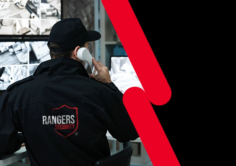 Rangers Security Group's 24/7 Control Center with an officer and mascot ensuring real-time security management for construction and urban areas.