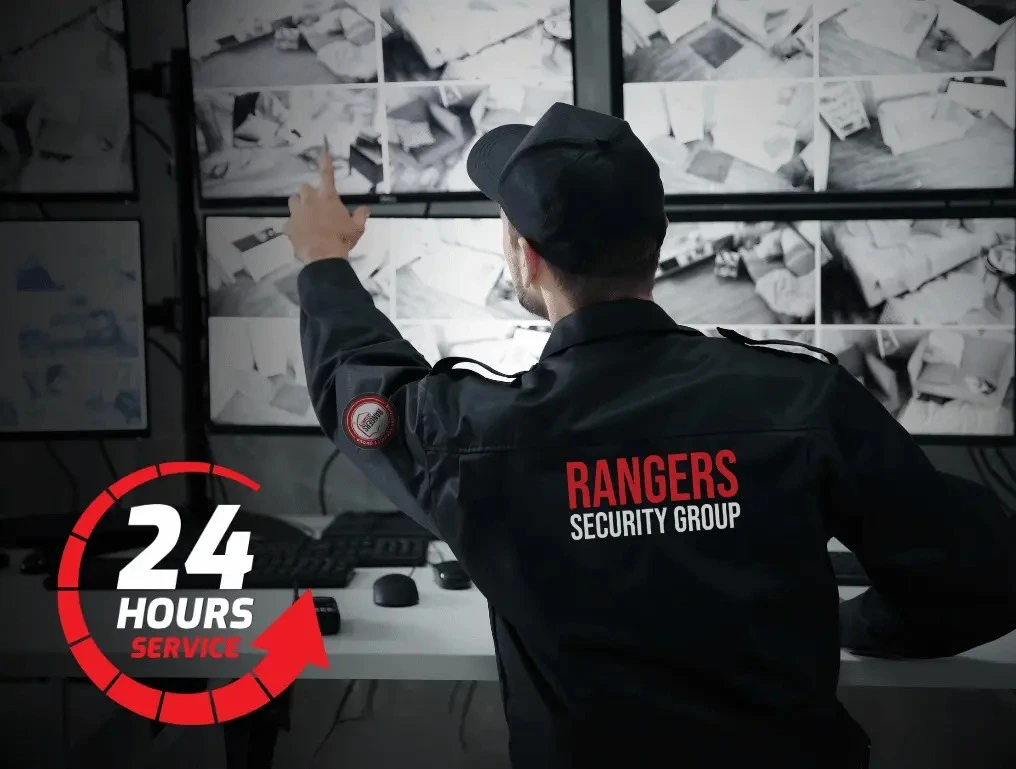 Rangers Security officer monitoring surveillance screens and watching the sites in real-time, highlighting 24/7 security services.