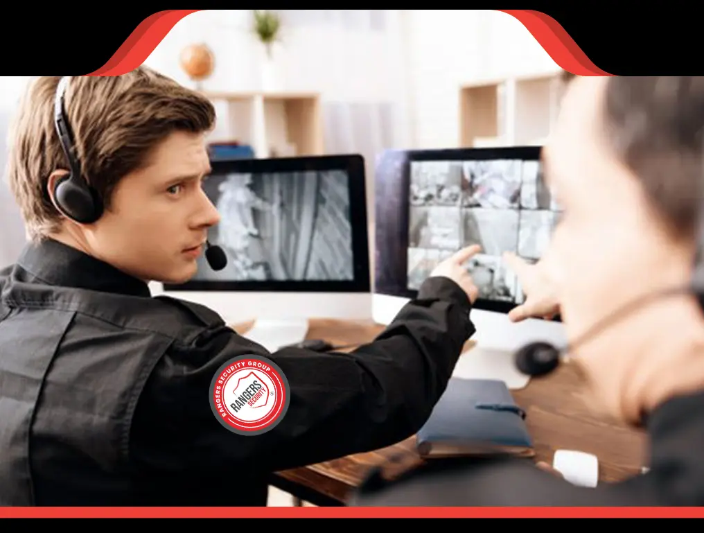 Security officer monitoring video feeds showcasing real-time surveillance by trained officers for enhanced safety