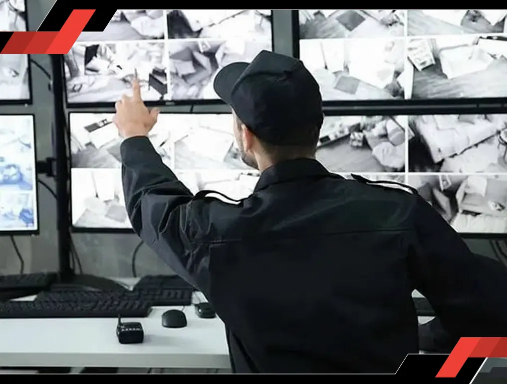 Security officer monitoring video feeds showcasing real-time surveillance by trained officers for enhanced safety