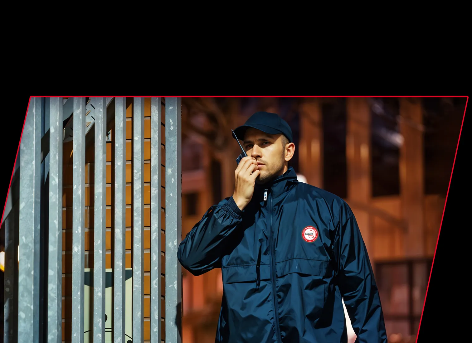 A uniformed Rangers Security officer with a walkie-talkie representing professional solutions for theft, vandalism, and trespassing issues in Manitoba.